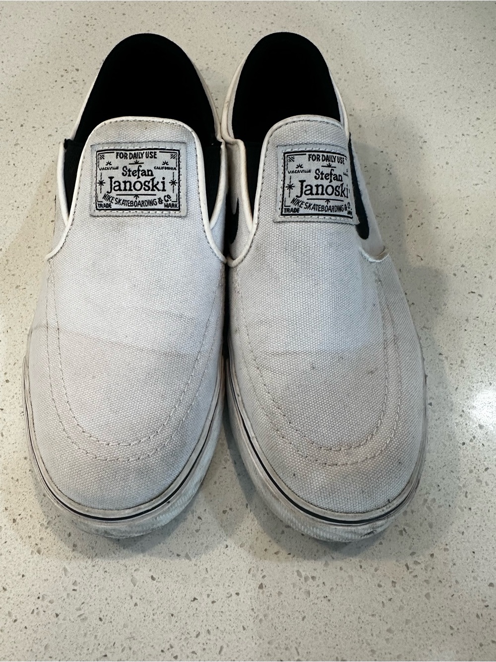 Nike Stefan Janoski White and Black Slip-On Canvas Sneakers